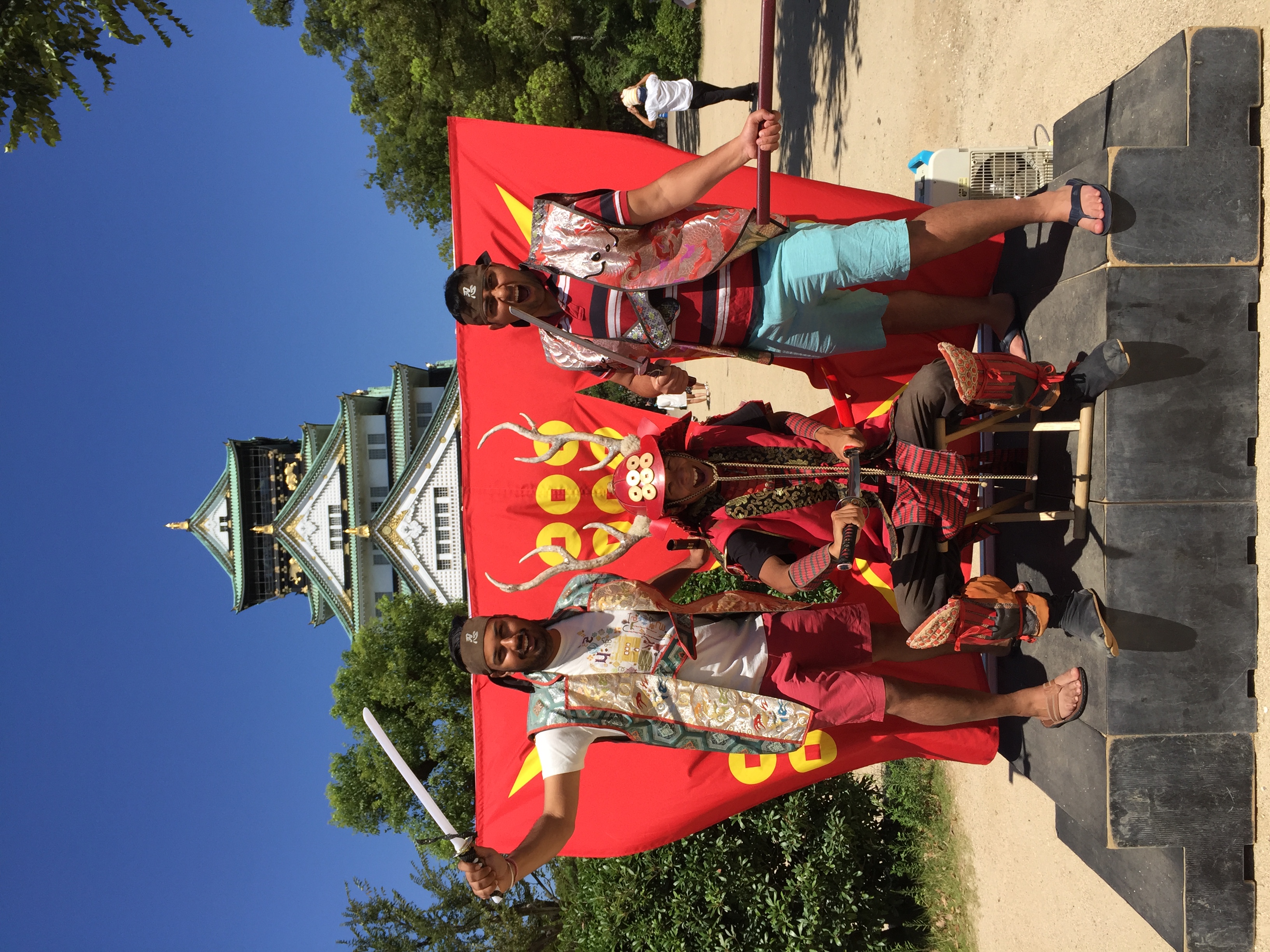 Outside Osaka Castle, posing with playful energy
